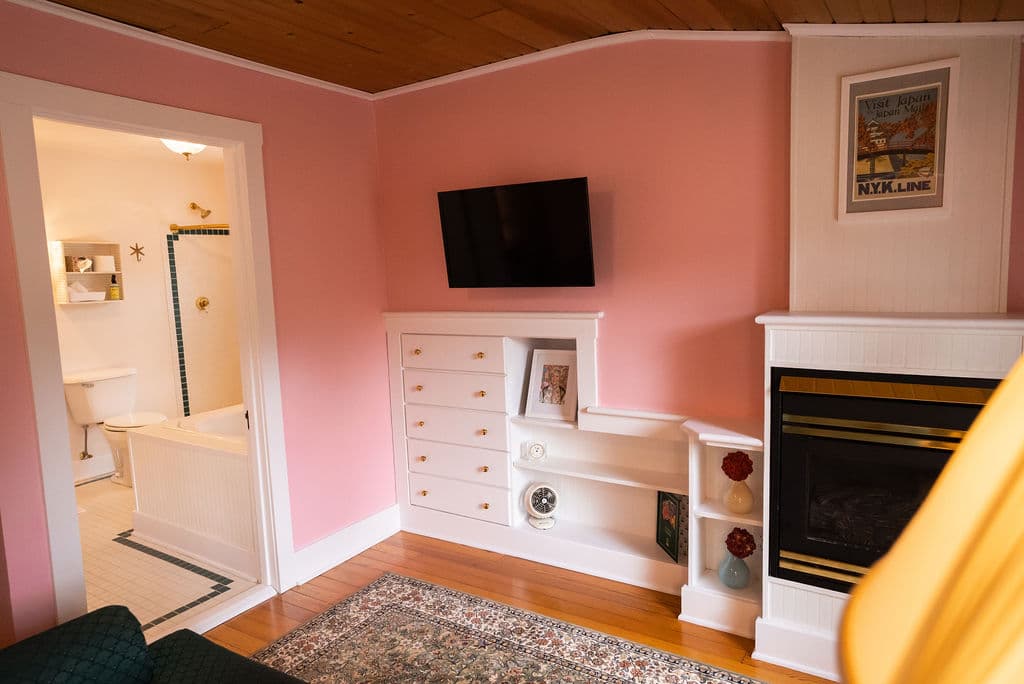 Rose room view of sitting area and door into bathroom