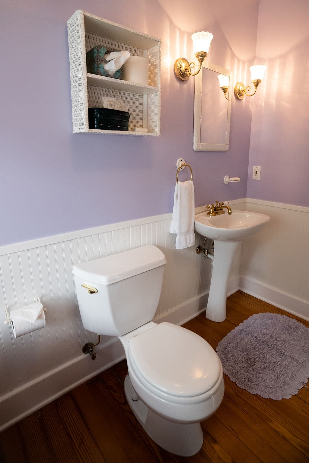 View of bathroom with pedestal sink and toilet