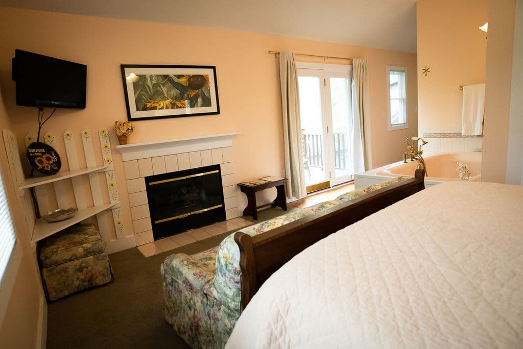 View from bedside looking out toward fireplace and patio
